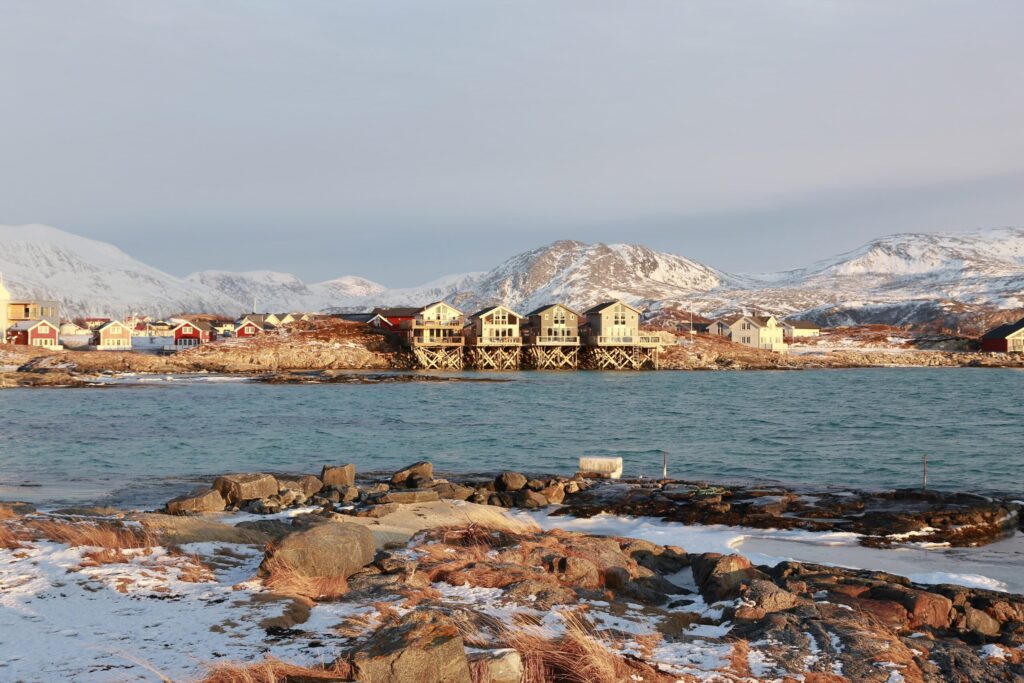 Panoramic view of the colorful fishing village of Sommarøy under the Arctic light in Norway.