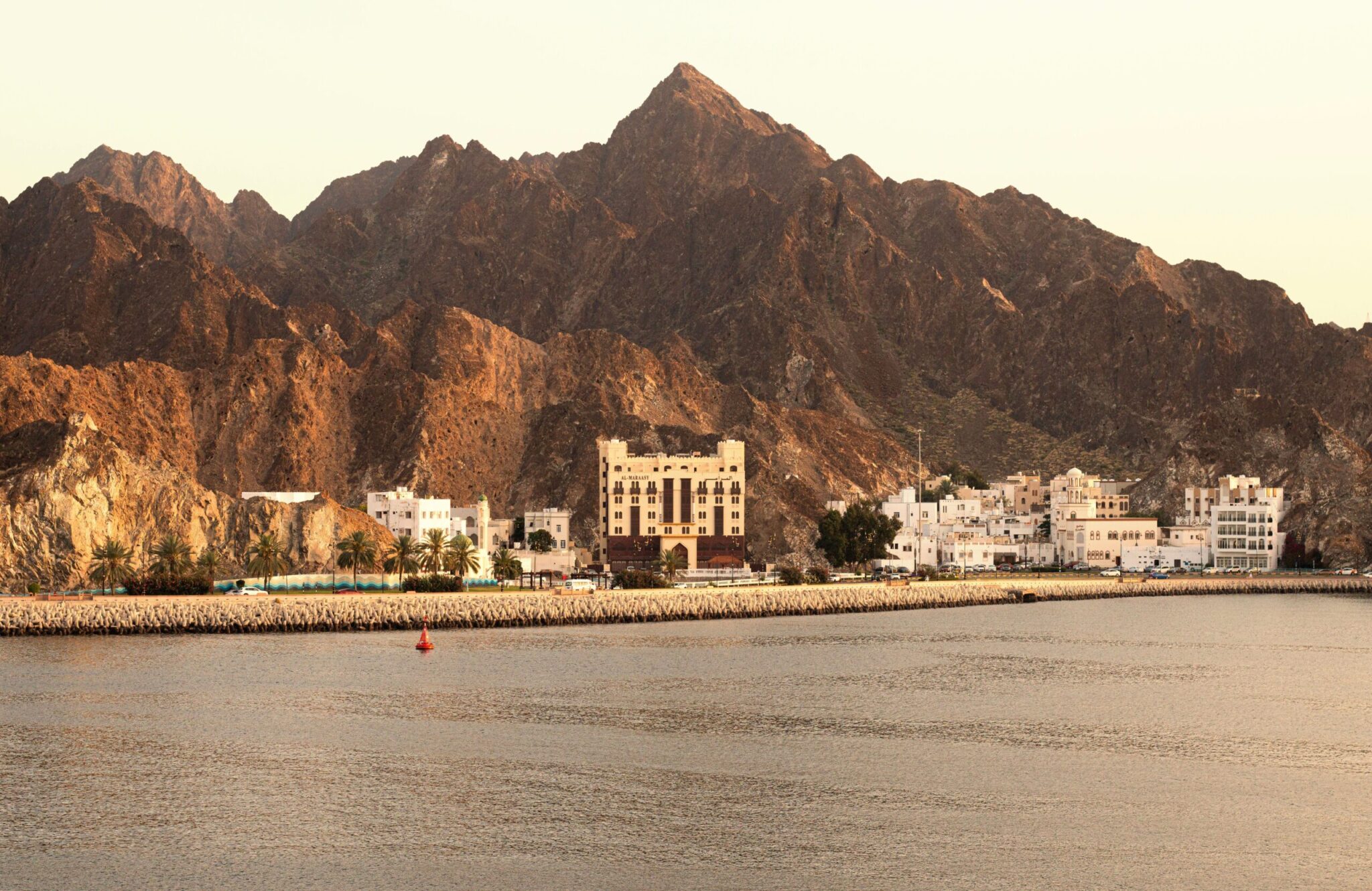 Coastal landscape at sunset in Oman, reflecting the historical and geographical charm of the frankincense route.