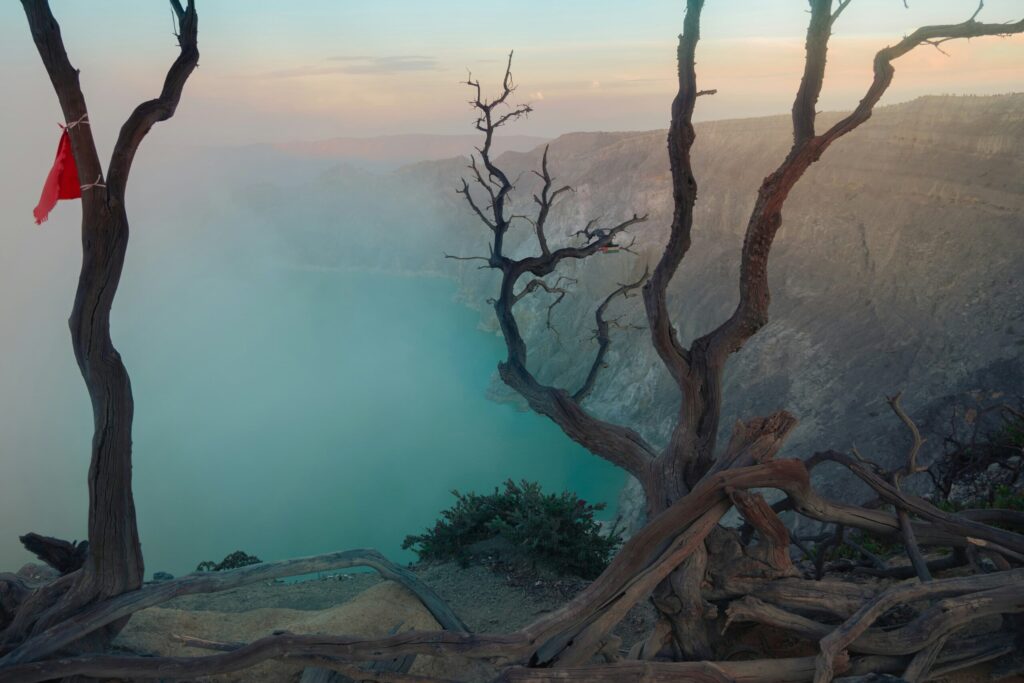 Panoramic view of the turquoise and highly acidic crater lake of the Kawah Ijen volcano in Java.