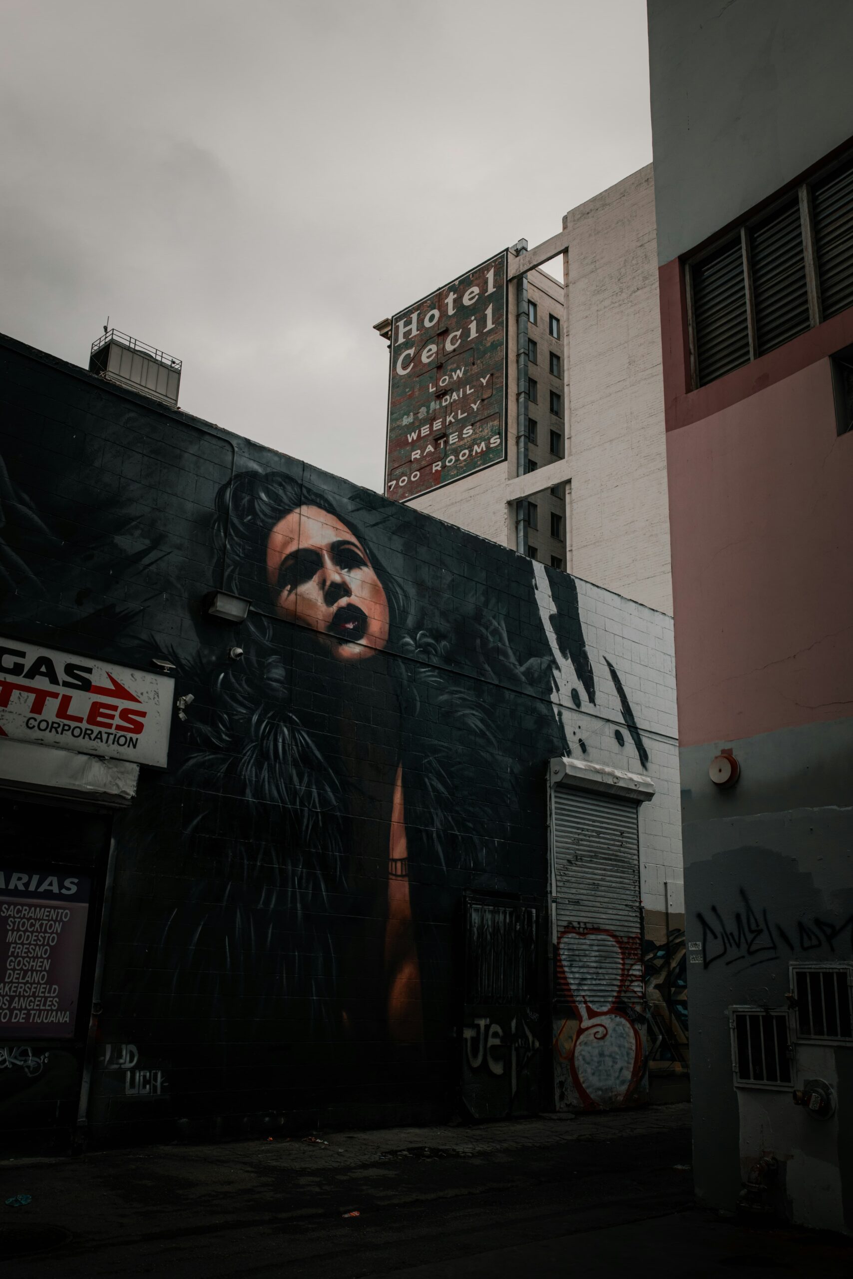 Urban mural on the facade of a building near the Cecil Hotel in the streets of Los Angeles.